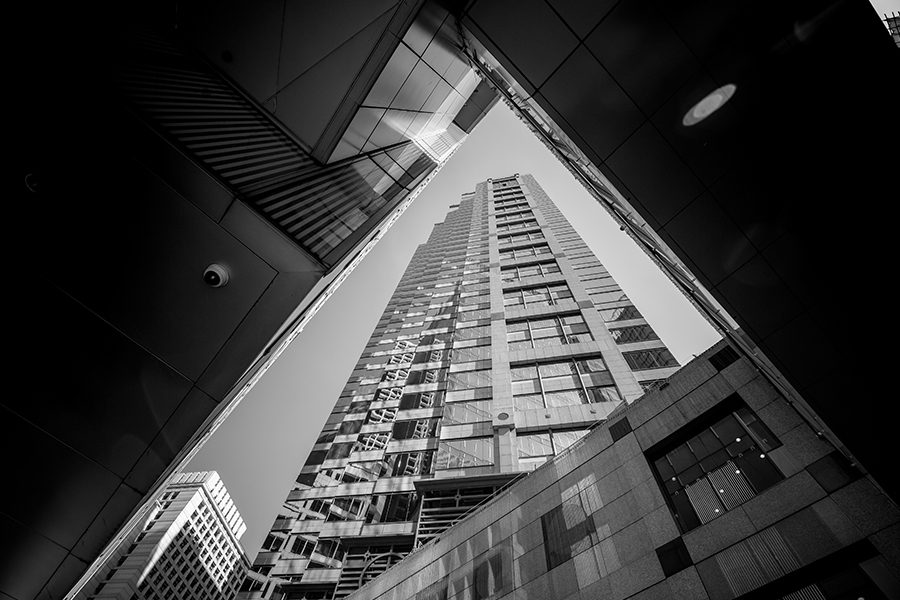 Business Insurance - Upwward View of Modern Architecture and Skyscrapers in Black and White