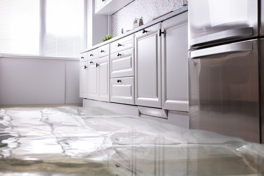 Flood Faqs - Close-up of Kitchen Floor Flooded with Water